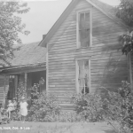 Loren, Jack, Zoe, and Lois in front of farmhouse